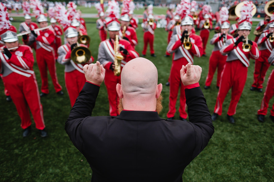 1st - Photographer of the Year - Small Market iCanton South marching band director Matt Stemple leads the band in warmups shortly before kickoff against Dover, Friday, Aug. 25 at Clyde Brechbuhler Stadium in Canton. (Andrew Dolph / The Times Reporter)