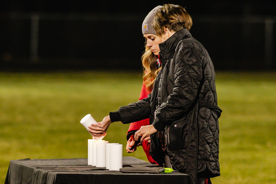 1st - Photographer of the Year - Small Market Six candles are lit to remember the deceased during the community prayer vigil, Tuesday, Nov. 14 at the Tuscarawas Valley Schools football stadium in Zoarville, Ohio. (Andrew Dolph / The Times Reporter)