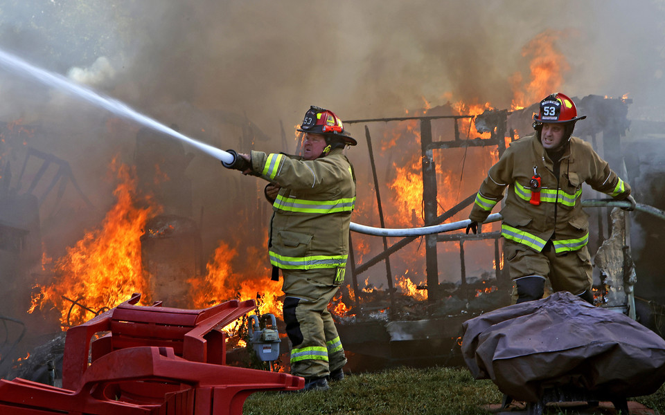 Award of Excellence - Photographer of the Year - Small Market Two mobile homes were destroyed by a fire and four others severly damaged Wednesday, Sept. 20, 2023 at the Honey Creek Mobile Home Park in Pike Township. Fire crews from six surrounding departments responded to the blaze. The arrived to find one mobile home fully involved and another partially involved. There were no injuries reported from the fire.  (Bill Lackey / Springfield News-Sun)