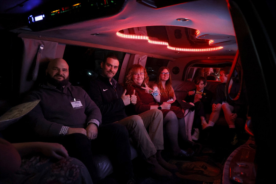 Award of Excellence - Photographer of the Year - Small Market A group of Night to Shine guests take a ride in a limousine during the Night to Shine event at the Lawrenceville Church of God Friday, Feb. 10, 2023.  (Bill Lackey / Springfield News-Sun)