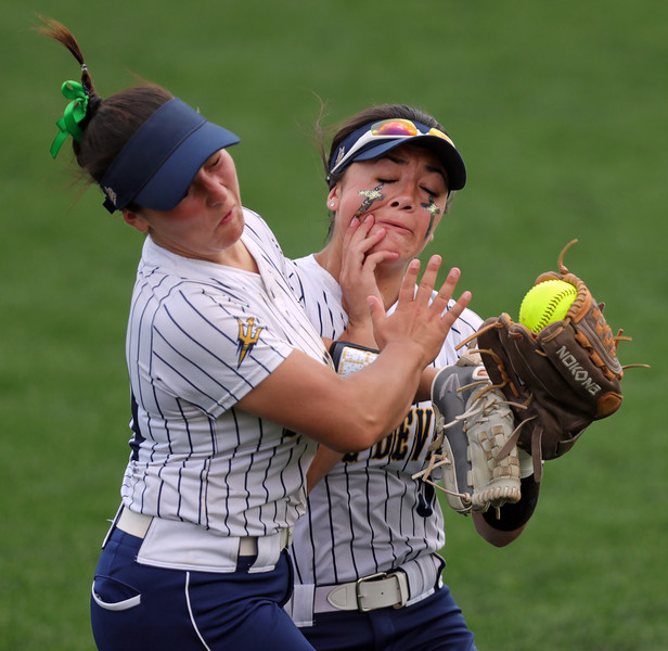 Sports Action - Award of Excellence, “Outfield Collsion”Tallmadge right fielder Leila Staszak (right) hangs onto a ball hit by Canfield batter Faith Morell as she collides with second baseman Emma Garbinsky to end the sixth inning of the OHSAA Division II state championship softball game at Firestone Stadium, Saturday, June 3, 2023, in Akron. (Jeff Lange / Akron Beacon Journal)