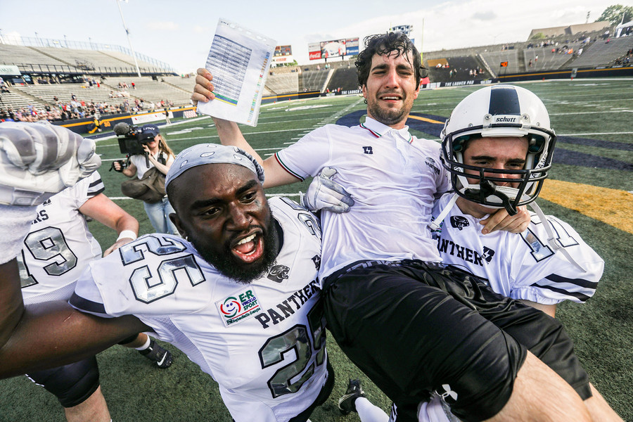 Award of Excellence - Ron Kuntz Sports Photographer of the Year Parma Panthers’ Mpoko Titi (left) and Rocco Bonvicini carries offensive coordinator Sandrino Baci on their shoulders after defeating Florence Guelfi in the Italian Bowl XLII at the University of Toledo’s Glass Bowl on Saturday July, 1 2023.  (Rebecca Benson / The Blade)
