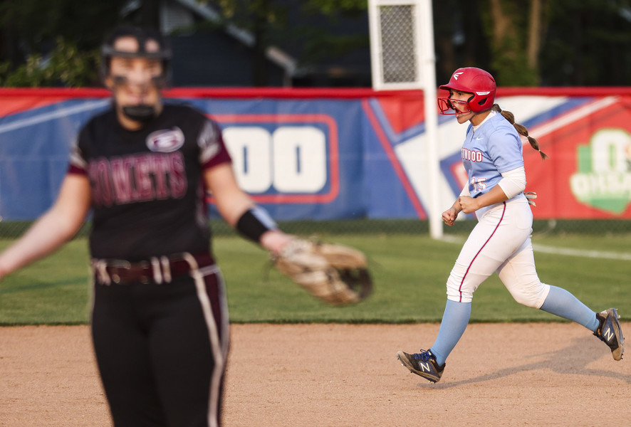 Award of Excellence - Ron Kuntz Sports Photographer of the Year Eastwood’s Delaney Maynard celebrates a home run off of Genoa’s Kaylin Shields (left) during the Division III district softball semifinals at the Blue Devils Field in Holland on Wednesday, May 17, 2023. Eastwood defeated Geonoa, 3-1.  (Rebecca Benson / The Blade)