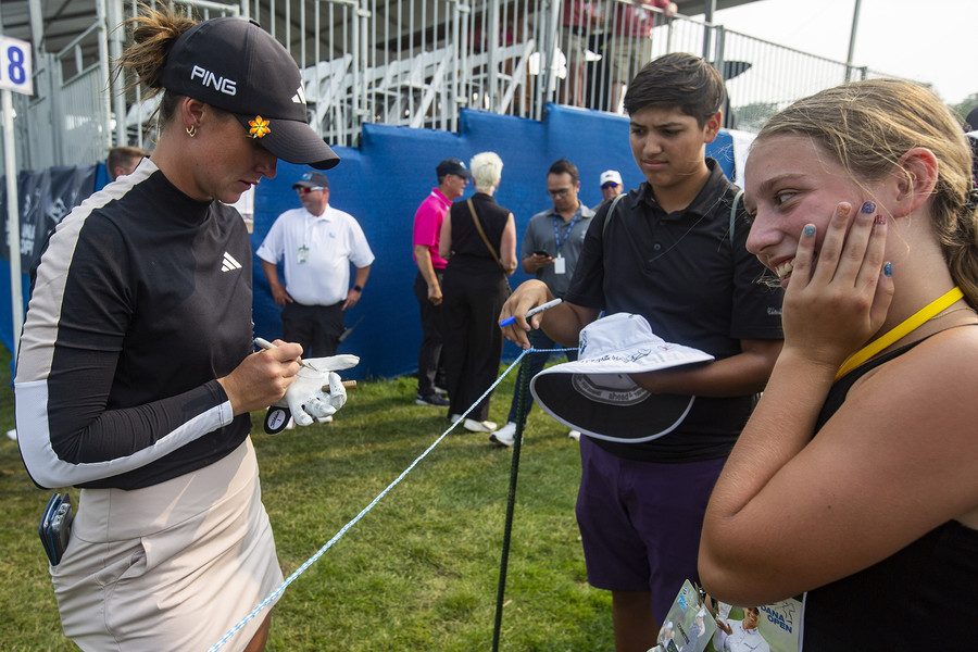 Award of Excellence - Ron Kuntz Sports Photographer of the Year Linn Grant signs autographs for young fans after winning the Dana Open at Highland Meadows Golf Club in Sylvania on Sunday, July 16, 2023.  (Rebecca Benson / The Blade)