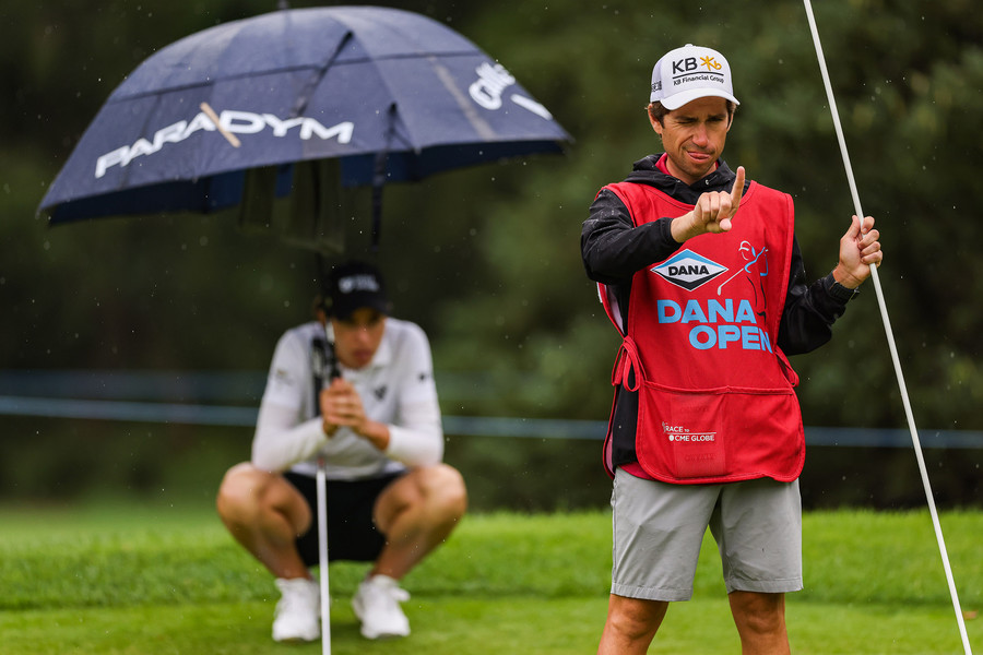 Award of Excellence - Ron Kuntz Sports Photographer of the Year Carlota Cignada’s caddie measures her shot during the third round of the Dana Open at Highland Meadows Golf Club in Sylvania on Saturday, July 15, 2023.  (Rebecca Benson / The Blade)