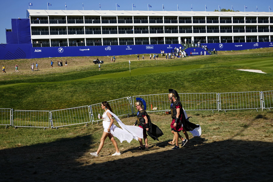 Sports Picture Story - 1st, “Ryder Cup”Team Europe fans walk along the seventh hole during day one fourballs round for the 44th Ryder Cup golf competition at Marco Simone Golf and Country Club.  (Adam Cairns / The Columbus Dispatch)
