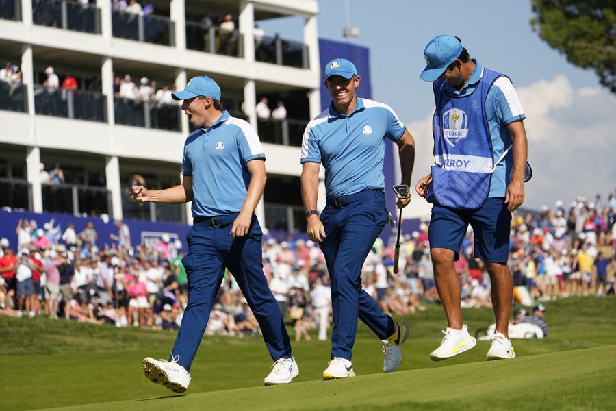 Sports Picture Story - 1st, “Ryder Cup”Team Europe golfer Matt Fitzpatrick (left) and golfer Rory McIlroy (right) react as they walk off the seventh hole during day one fourballs round for the 44th Ryder Cup golf competition at Marco Simone Golf and Country Club.  (Adam Cairns / The Columbus Dispatch)
