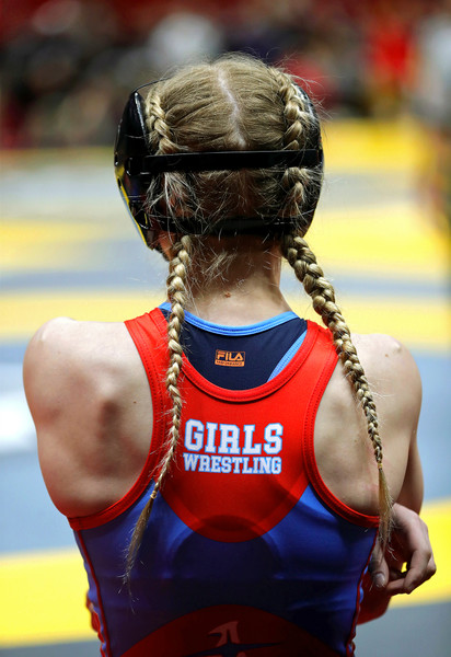 Sports Picture Story - 2nd, “Girls State Wrestling”Ashlynn Pennington of Alliance waits on deck before her 105-pound match in the OHSAA state wrestling tournament at the Jerome Schottenstein Center, Friday, March 10, 2023, in Columbus, Ohio. (Jeff Lange / Akron Beacon Journal)