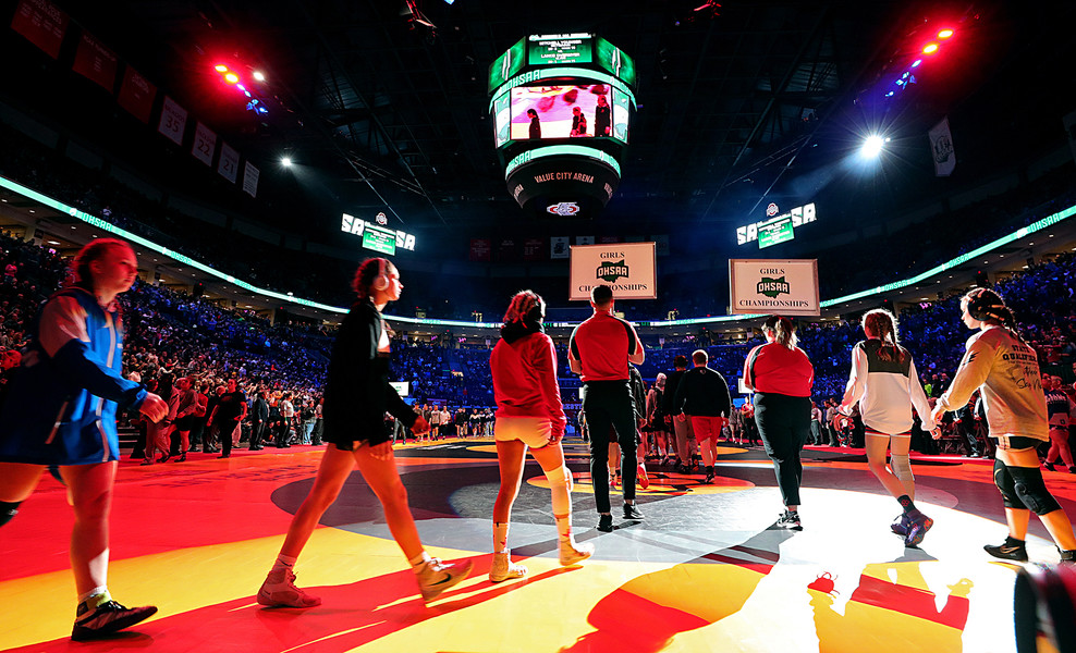 Sports Picture Story - 2nd, “Girls State Wrestling”Girls march around the arena during the Parade of Champions before the OHSAA  state wrestling tournament at the Jerome Schottenstein Center, Sunday, March 12, 2023, in Columbus, Ohio. (Jeff Lange / Akron Beacon Journal)