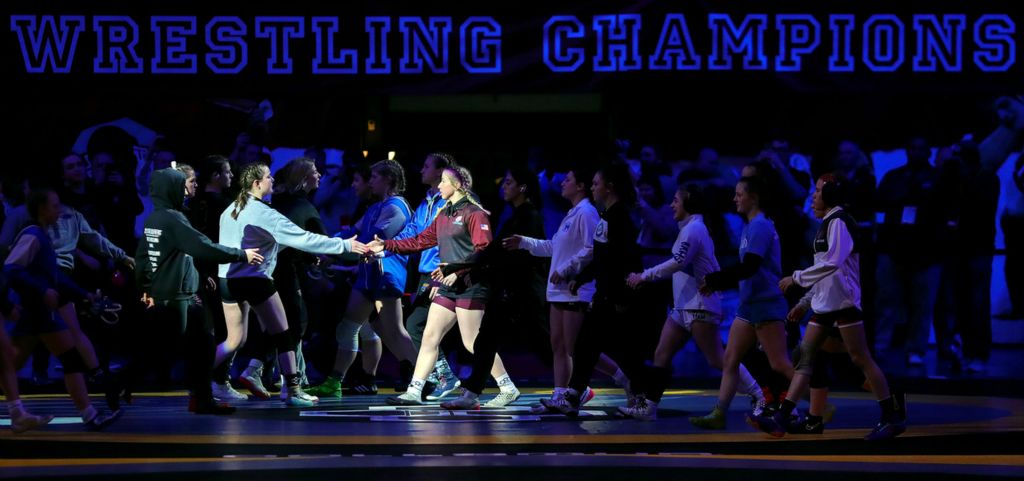 Sports Picture Story - 2nd, “Girls State Wrestling”Girls shake hands with their opponents before the OHSAA  state wrestling tournament  at the Jerome Schottenstein Center, Sunday, March 12, 2023, in Columbus, Ohio. (Jeff Lange / Akron Beacon Journal)