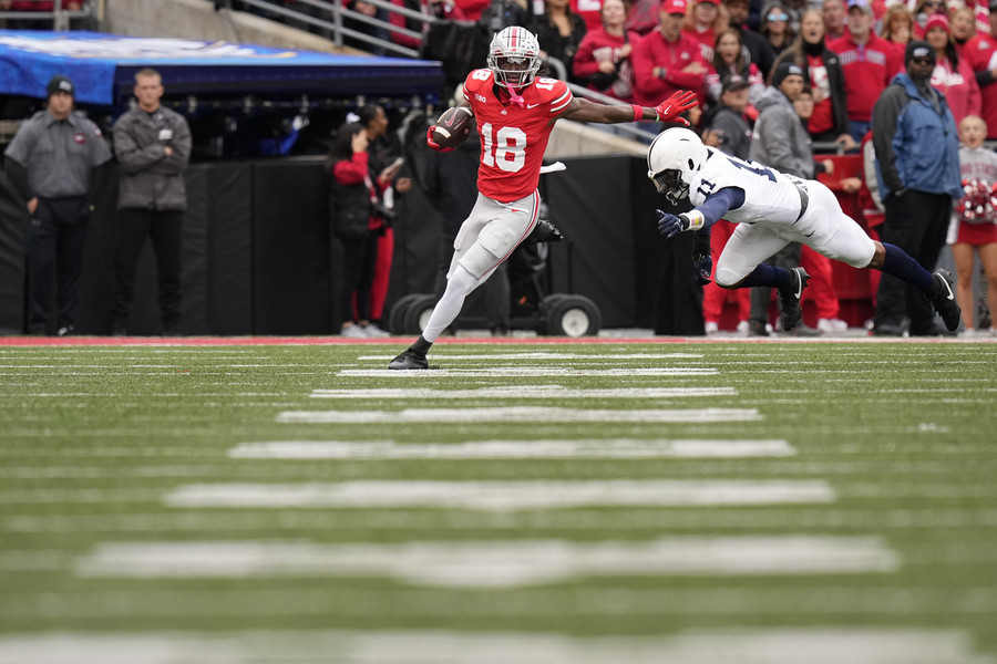 Sports Picture Story - 3rd, “Marvin Harrison Jr. ”Ohio State wide receiver Marvin Harrison Jr. (18) catches a pass in front of Penn State inebacker Abdul Carter (11) during the second half of the NCAA football game at Ohio Stadium. Ohio State won 20-12. (Adam Cairns / The Columbus Dispatch)