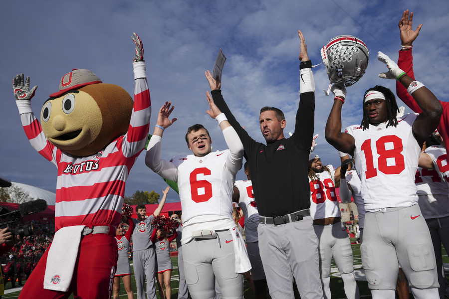 Sports Picture Story - 3rd, “Marvin Harrison Jr. ”Ohio State quarterback Kyle McCord (6), offensive coordinator Brian Hartline and wide receiver Marvin Harrison Jr. (18) sing “Carmen Ohio” following the NCAA football game against Rutgers at SHI Stadium. Ohio State won 35-16. (Adam Cairns / The Columbus Dispatch)