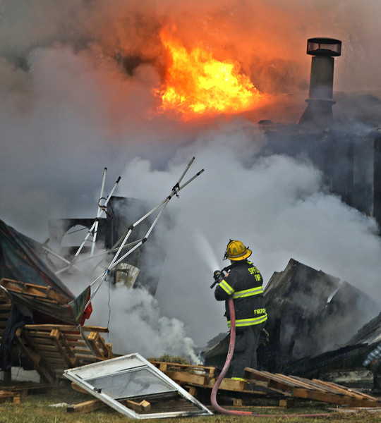 First Place, Photographer of the Year - Small Market - Bill Lackey / Springfield News-SunFire fighters from three Clark County departments battled a house fire Thursday, Feb. 22, 2024 in the 10,000 block of Plattsburgh Road on the east side of the county. The residents, who were home at the time of the fire, all escaped without injury, however, the condition of the family's pets were unknown at the time.