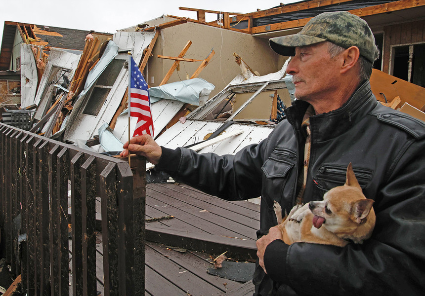 First Place, Photographer of the Year - Small Market - Bill Lackey / Springfield News-SunAfter finding a small flag in the rubble that was his house, Ron Watt posts it on the remains of his deck Friday morning. Ron and his dog, Pearl, took shelter in a bathtub as a tornado destroyed his home and much of Lakeview, Ohio Thursday night. Ron said he has lived in the house for more than 30 years and plans to rebuild his home. 