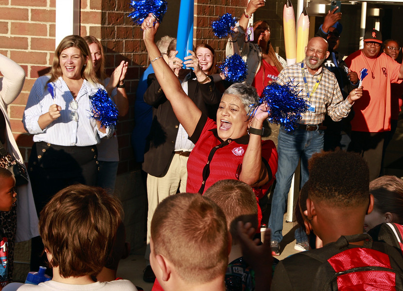 First Place, Photographer of the Year - Small Market - Bill Lackey / Springfield News-SunFulton Elementary School Principal Deborah Howard celebrates with members of the community during a "Fulton First Day Clap-in" for the students as they arrive at school Wednesday, August 14, 2024. 