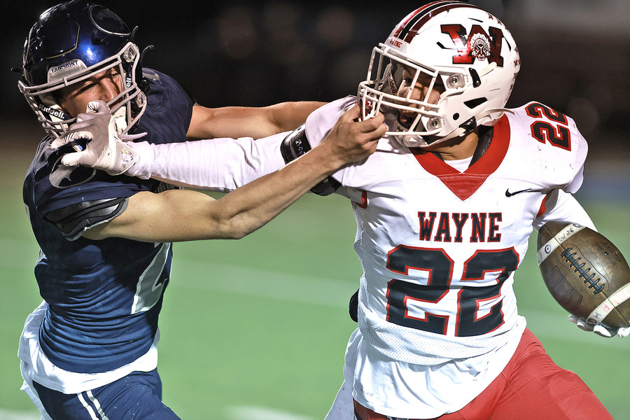 First Place, Photographer of the Year - Small Market - Bill Lackey / Springfield News-SunWayne's Isaiah Thompson tries to avoid a tackle by Fairmont's Jack Probasco during round two of the playoffs Friday, Nov. 8, 2024. 