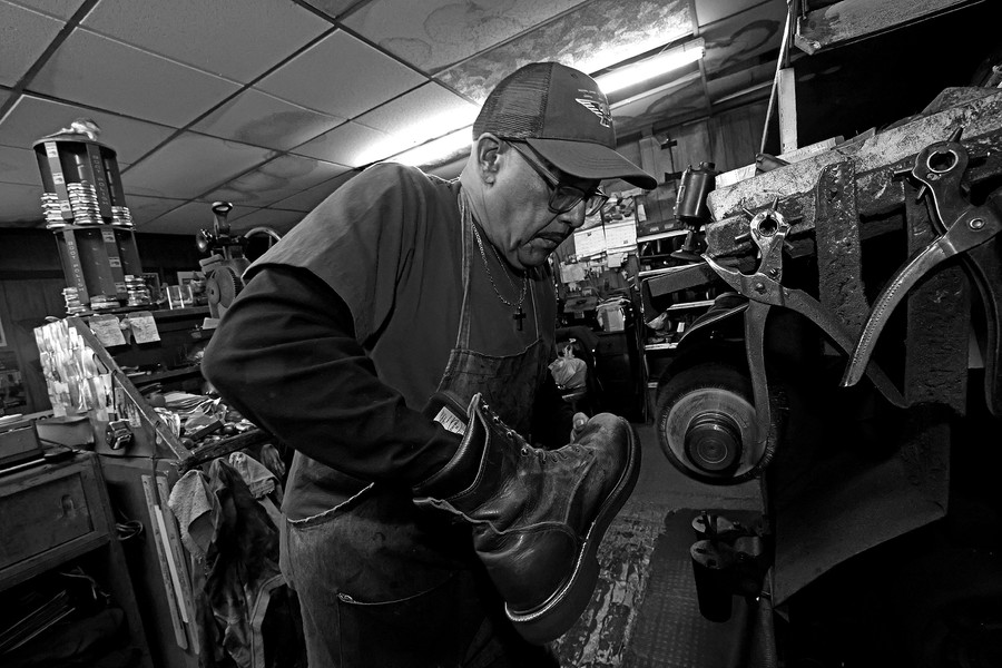 First Place, Photographer of the Year - Small Market - Bill Lackey / Springfield News-SunClifford Borden, owner of Pritchet Shoe Service, is the sole survivor of Springfield's brotherhood of cobblers. Every week day the 74-year-old opens his tiny shop and takes in shoes to repair or just polish. Borden started working in the shop in 1974 and took it over from his father-in-law in 1990. He said there used to be several shoe repair businesses in Springfield but the owners either retired or died. "You can tell a lot about a person from the shoes they wear." Borden said, "and a fine pair of shoes can make you feel like a million dollars."Clifford Borden buffs out a pair of work boots after replacing the sole at Pritchet Shoe Service. 