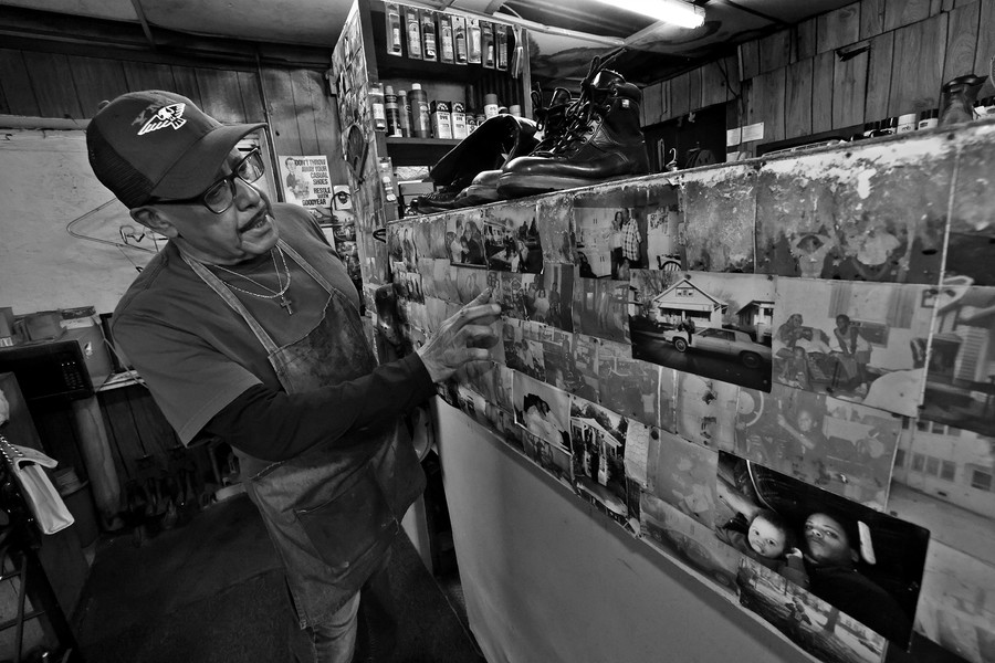 First Place, Photographer of the Year - Small Market - Bill Lackey / Springfield News-SunClifford proudly talks about the faded photos of his children, taped to the work bench in his shop.  Both of his children worked in the shop when they were young. 