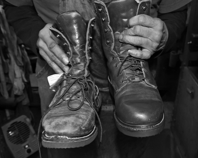 First Place, Photographer of the Year - Small Market - Bill Lackey / Springfield News-SunClifford shows the before and after a pair of boots was repaired and polished. 