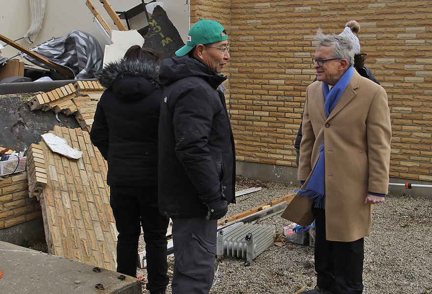 First Place, Photographer of the Year - Small Market - Bill Lackey / Springfield News-SunGovernor Mike DeWine talks to Shoji Uota and Emi Campbell at their home on Ridge Road that was destroyed by a tornado early Wednesday morning. 