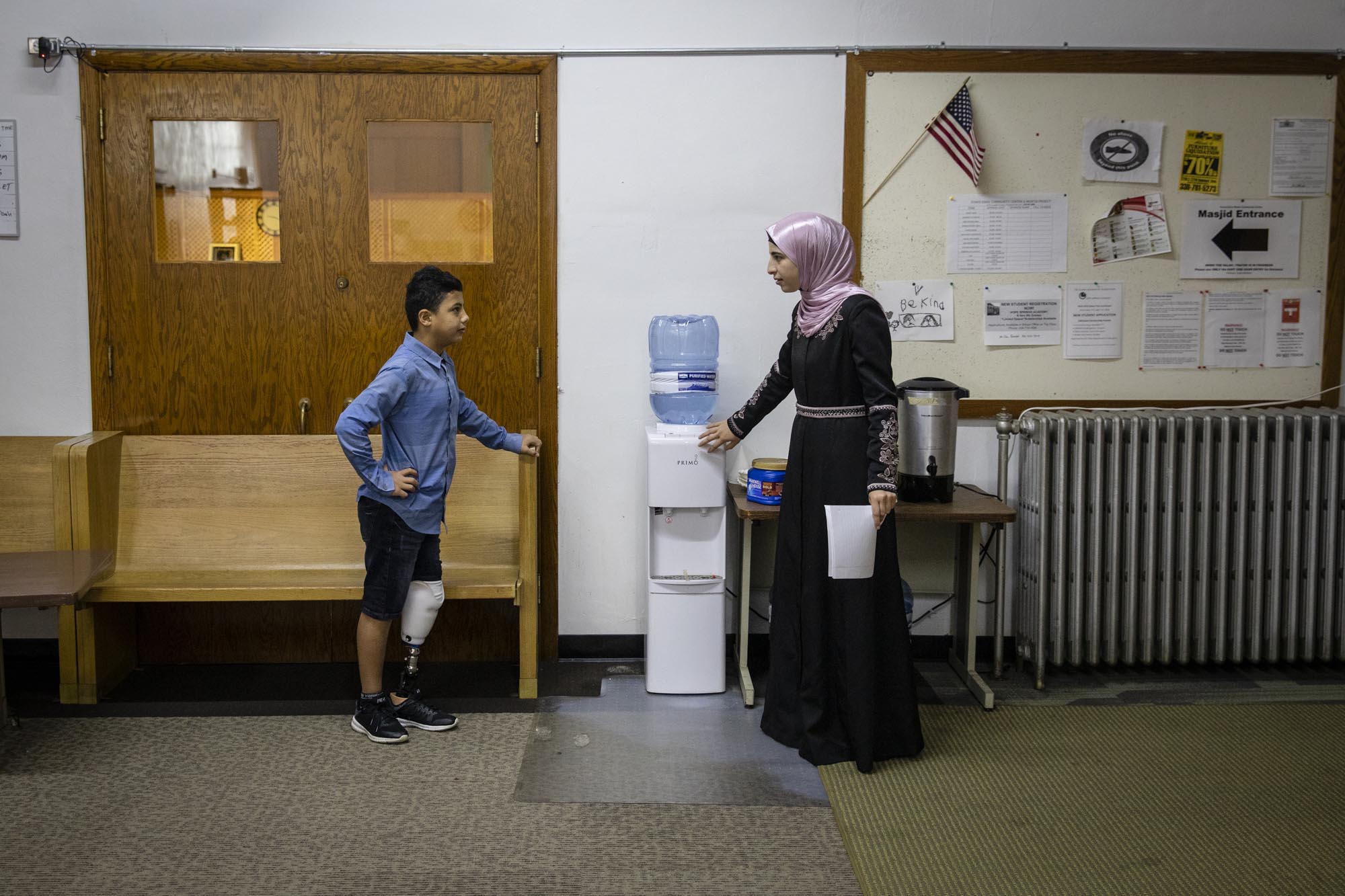 Abood tries to remember how to say “water-cooler” in English after his teacher, Hanadi Mujahed, asks. During some of his time in the United States, Abood attended school at the Yunus Emre Muslim Community Center, where he grew close to Hanadi.