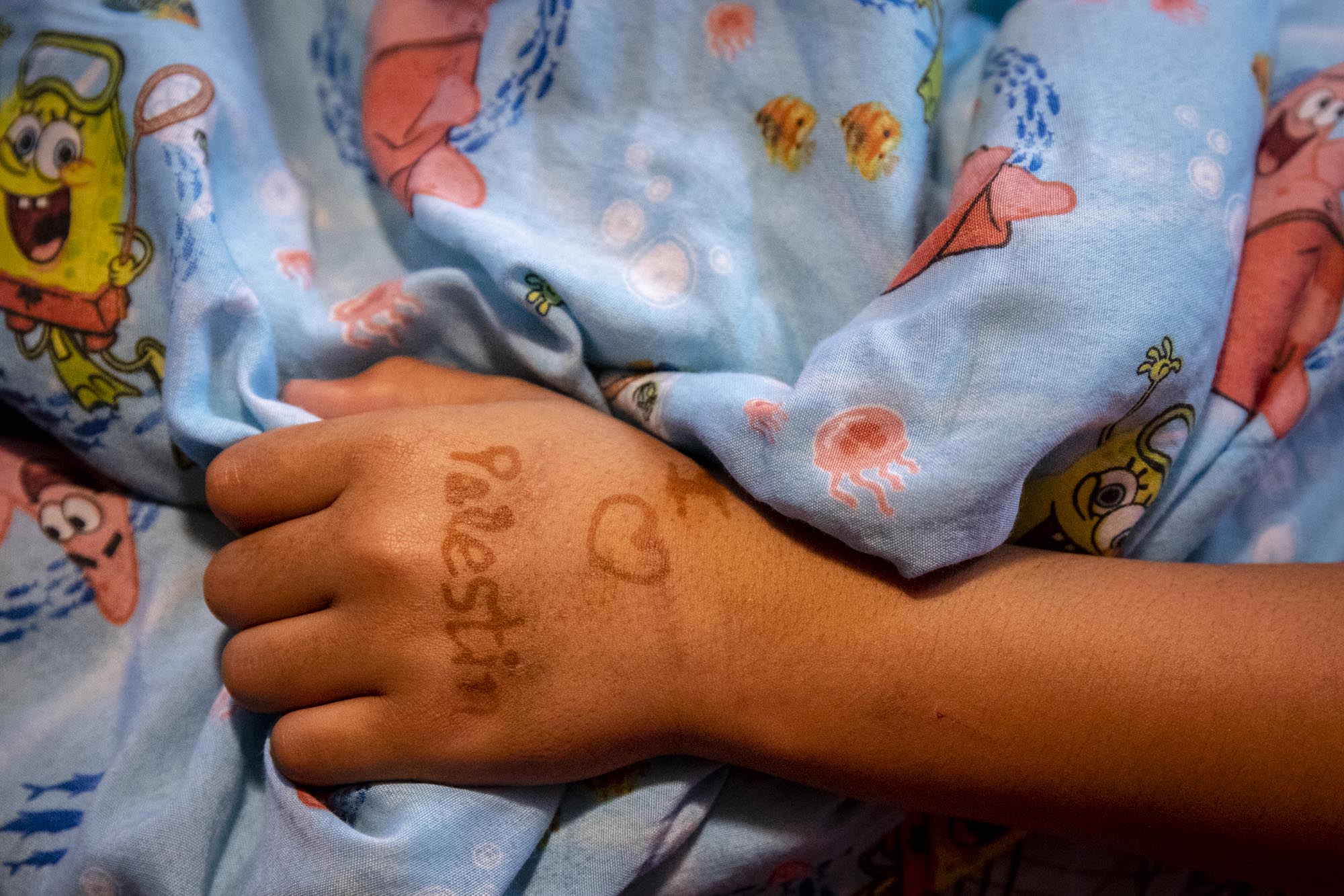 Clutching at his blanket as he watches ÒLittle RascalsÓ in English, which he does not speak, with his host Yousef Mousa and YousefÕs sister, Sama, Abood mocks Donald Trump after seeing him appear on screen. On AboodÕs hand is written ÒI (heart) Palestin.Ó Before he was able to move well on his prosthetic, he told Hanadi that all he wanted to do was go home and die for his country.Ó As time went on, he grew happier, and told her that was no longer his dream.