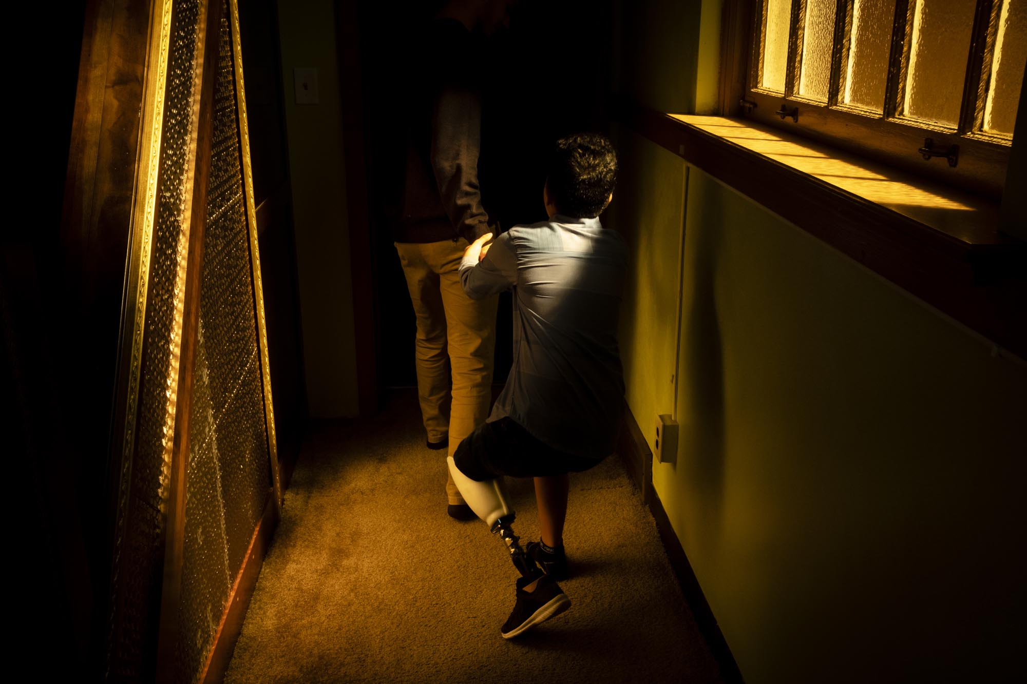 Abood pulls on Yousef’s arm as they leave prayer, trying to get his attention. The two shared a close relationship during Abood’s time in the United States, one Yousef compared to brotherhood.