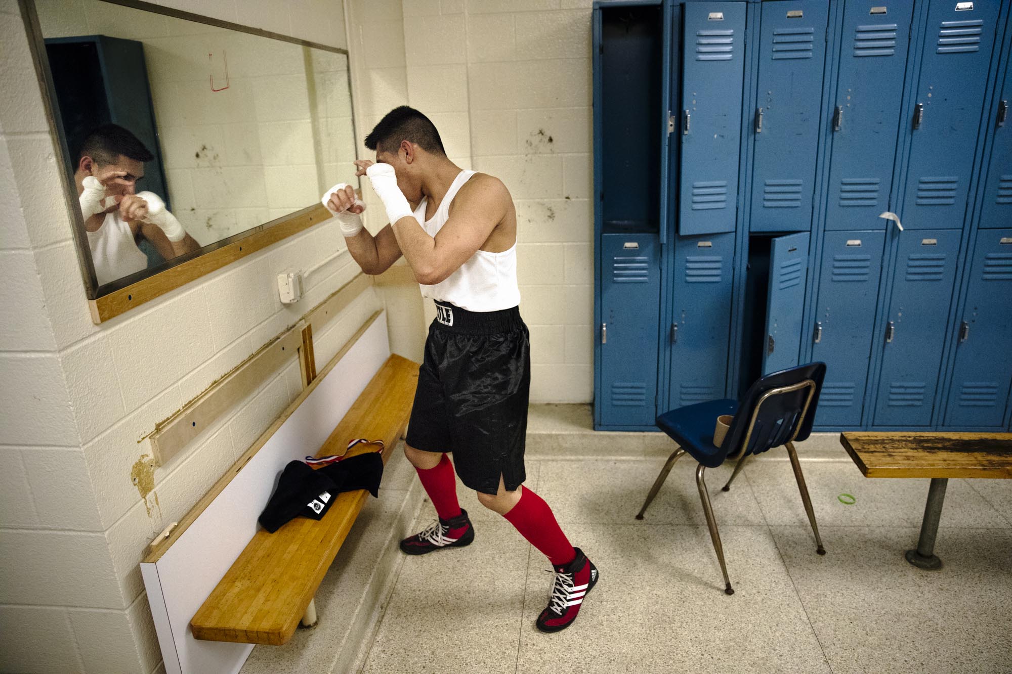 Juan Lugo angrily shadow boxes in the locker room after losing his bout with Brian Cotts by split decision at the Charity Brawl in Elyria, Feb. 19, 2018.