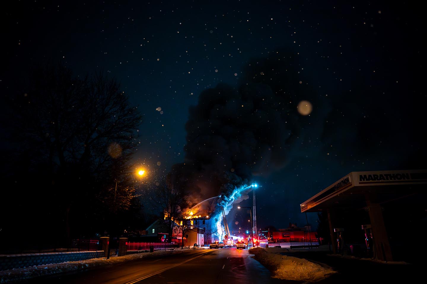 December - 2nd place spot news - Tyler Darling waves a Black Lives Matter flag among motorcycle tire smoke on High Street during a protest that started at the Franklin County Sheriff's Office building in Columbus. 500 protesters were demanding justice for Casey Goodson Jr. after Deputy Jason Meade fatally shot Goodson at his home in the Northland neighborhood on the city's northeast side. Kyle Robertson / The Columbus Dispatch
